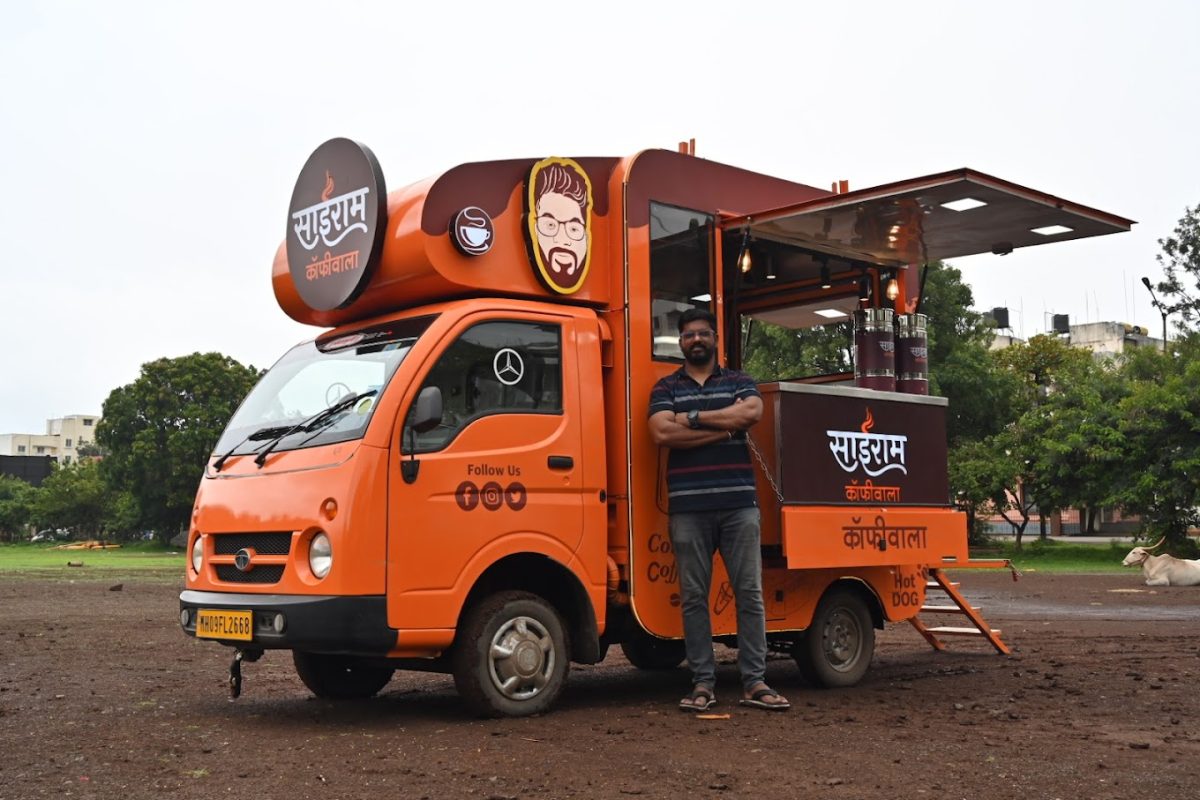 Sairam Coffeewala - founder Sairam Kulkarni along with his food truck posing for a photoshoot.